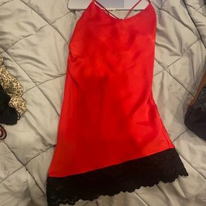 slip silk cross back dress with a lace detail on the bottom